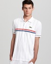 Part of Andy Roddick's premier line of athletic tennis wear, this fast-drying polo matches your active lifestyle and is embellished with signature Roddick and Lacoste details at the left chest and lower right hem.