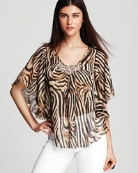 A vibrant swirl of tiger stripes enlivens this sheer Karen Kane top, finished with a beaded neckline for a glamorous walk on the wild side.