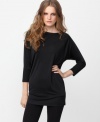 Back cutouts add eye-catching appeal to this otherwise simple RACHEL Rachel Roy tunic -- adorable over leggings or skinny jeans!