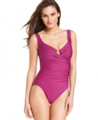 Fit to flatter, this chic one-piece swimsuit from Miraclesuit flaunts an elegant surplice neckline and slimming technology so you'll look and feel amazing at the beach, pool or wherever your swimwear takes you!