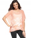 In a sheer floral-printed fabric, this poncho-style Alfani top is a hot spring layering piece!