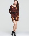 Go for bold in this formfitting Free People dress, boasting a statement-making eclectic print.