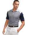 With a sporty, zip-neck polo shirt, this Greg Norman for Tasso Elba is performance styling at its finest.