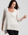 A longer length and relaxed silhouette distinguishes this Eileen Fisher tunic sweater as an off-duty wardrobe staple.