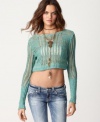 Free People's lightweight sweater is ultra soft and perfect for layering. Wear it over a bandeau for a sexy look!