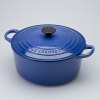 Le Creuset 2.75-qt. round French oven. This enameled cast iron casserole goes easily from oven or stovetop to the table. Ideal for cooking and re-heating risotto, soups, stew, and for simmering or slow-cooking foods. Secure lid seals in moisture and flavor. Retains heat well and is beautiful enough for tabletop serving. Features sturdy, cast handles and is oven-safe to 450 degrees.