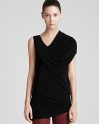 A draped Helmut Lang tunic makes a modern statement with asymmetric sleeves, an angled hem and cool cowl neckline. Teamed with leather skinnies, the look is nightclub-ready and you're haute on the scene.
