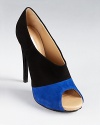 In bold blue and classic black, DIANE von FURSTENBERG's Judith booties pack a stylish punch.