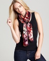 A bohemian oblong scarf with colorful ikat print and self fringe edges.