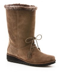 These playful Stuart Weitzman boots have '50s flair, lined with faux fur and finished off with fun tassel details.