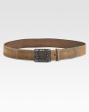 Distressed leather and a beaded openwork silvery buckle create a rich contrast of the rugged and the refined.Distressed leather strap and keeperRectangular openwork buckle with adjustable stud closureWidth, about 1½Imported