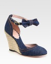 Held in place by an adjustable, bow-adorned ankle strap, this stretchy denim classic is updated by a unique espadrille wedge. Hemp wedge, 4 (100mm)Denim upperDenim liningLeather solePadded insoleMade in ItalyOUR FIT MODEL RECOMMENDS ordering true size. 