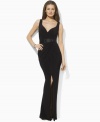 Lauren by Ralph Lauren's elegant evening gown flatters every curve in body-skimming matte jersey and is finished with an alluring V-neckline, feminine pleats and a sultry slit at the skirt