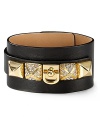 Glamor gets gritty with this leather cuff from Juicy Couture, accented by bold pyramid studs.