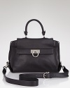 Salvatore Ferragamo's crossbody satchel in luxurious leather lends a sophisticated finish to your workday looks.