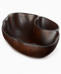 Carved and sanded by hand, the Selena chip and dip bowl--designed by Einstein Albert for Heart of Haiti serveware--is made from the wood of sustainable obeche trees that are farm raised and harvested by the artisans themselves. A rich stain highlights the organic beauty of a serving piece that's inspired by the moon goddess, but entirely down to earth.
