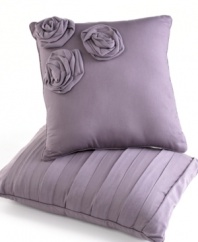 Complete your totally relaxed sleep space with this Neveah decorative pillow, featuring ultra-soft cotton jersey with three applique roses for a dash of style.