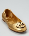 In metallic, tumbled leather, this updated take on Tory Burch's iconic Reva flat has us swooning.