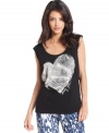 This soft tank from DKNY Jeans is anything but basic. It features a metallic heart and logo design at the front for a bit of flirty style and a cool silhouette for the right downtown edge.