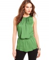 Dress up your work wardrobe with a silky sleeveless top from Vince Camuto. The elegant draped front and blouson effect look polished in the office and keep you looking chic for a night out.