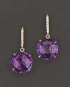 Pavé diamonds and amethyst sparkle in an 18K yellow gold setting.