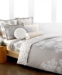 The Snow Willow comforter set captures the beauty of winter in neutral colors fit for all seasons. Scattered white branches grow across a muted, geometric design while the reverse presents a collection of these branches in calming color.