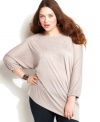 Shimmer from day to night with INC's three-quarter sleeve plus size top, accented by a rhinestone finish.