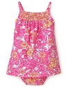 The perfect sunny dress for summer gatherings, this sleeveless bloomer and dress set is replete with bright floral patterns.