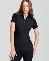 Timeless and seasonless--the makings of a staple. Do basics Brit-style with this classic polo. From Burberry Brit.