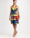 Pleated halter dress with an exposed back zipper, artfully crafted in vibrant, painterly stripes. HalterPlunging v-neckSlash pocketsBack zipperAbout 22 from natural waistCottonDry cleanMade in USA of Italian fabricModel shown is 5'9½ (176cm) wearing US size 2.