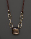 Hammer faceted cushion cut smoky quartz adds rich sparkle to leather and links of 14K yellow gold. By Nancy B.