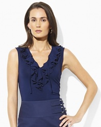 A cascade of ruffles exudes feminine style in our Stu sleeveless top, fashioned from sleek jersey.