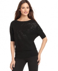 Sequins add shine to this Calvin Klein sweater for a subtle sparkle that's casually chic!