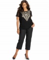 Spice up your style with INC's plus size embroidered top. The sheer sleeves and studded accents add up to one hot look!
