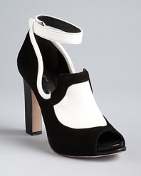 Black and white and red hot all over: these Rachel Roy platform pumps feature distinctive high-contrast oxford styling.