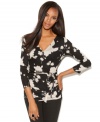 Flowers get a new, edgier look. The flattering wrap silhouette sets off the graphic look of the floral print perfectly!
