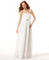A romantic look infused with old-Hollywood glamour, this strapless Adrianna Papell gown makes a lasting impression.