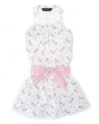 Absolutely charming dress in soft floral cotton jersey with a crocheted racerback silhouette and a pretty sash.