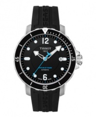 On dry land or underwater, the Seastar 1000 watch from Tissot is ideal for the adventurous gentleman. Crafted of black rubber strap with logo detail and round stainless steel case. Black dial features silver tone dot markers, logo, date window at three o'clock, minute track, silver tone hour and minute hands, blue second hand and numerals at twelve and six o'clock. Includes helium valve for depressurizing watch. Swiss automatic movement. Water resistant to 300 meters. Two-year limited warranty.
