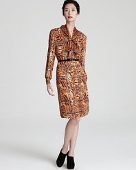 Work the abstract in a tiger print Escada shirt dress, rendered in sumptuous silk.