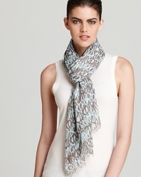 A sheer oblong scarf with linear MARC BY MARC JACOBS printed all over for a statement-making scarf style.
