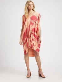 Vibrantly printed jersey in a caftan-inspired silhouette with an asymmetrical hi-low hem, short dolman sleeves and a plunging v-back. V-neckShort dolman sleevesAsymmetrical hi-low hemPlunging v-backAbout 28 from natural waist92% modal/8% spandexDry cleanMade in USAModel shown is 5'10 (177cm) wearing US size Small.