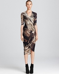 A painterly print adorns this artfully constructed Helmut Lang jersey dress with wrap-style skirt.