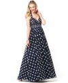 Polka dots keep things playful on Adrianna Papell's evening gown. The navy and white colors are perfect for pairing with pearls or red accessories!